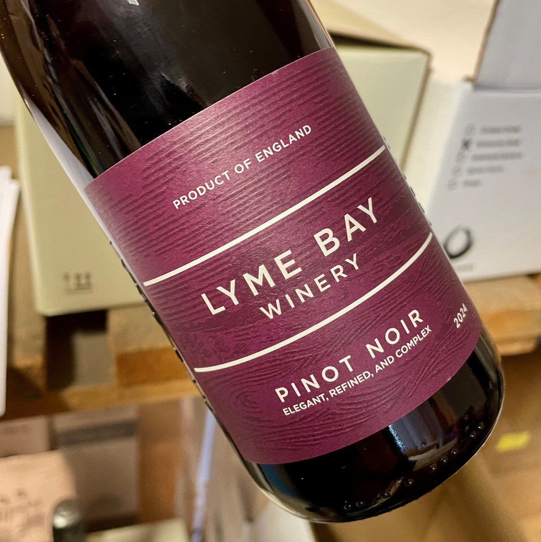 Bottle of Lyme Bay Winery Pinot Noir wine with a blurred background